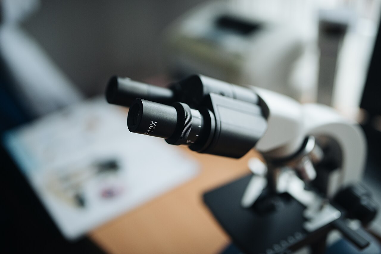 Close-up of the ocular lenses of a microscope with a blurry background