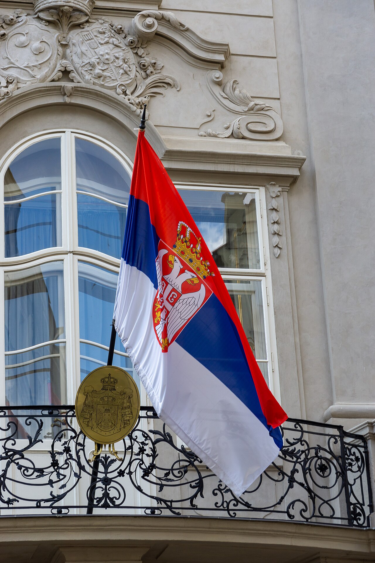 Flag of Serbia flies outside the Embassy of the Republic of Serbia in Prague