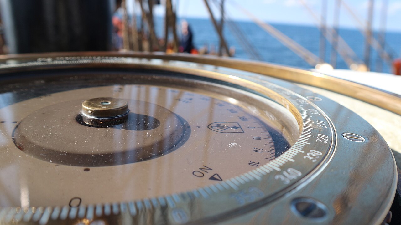 Detail of the Compass on deck of the Roald Amundsen under sails