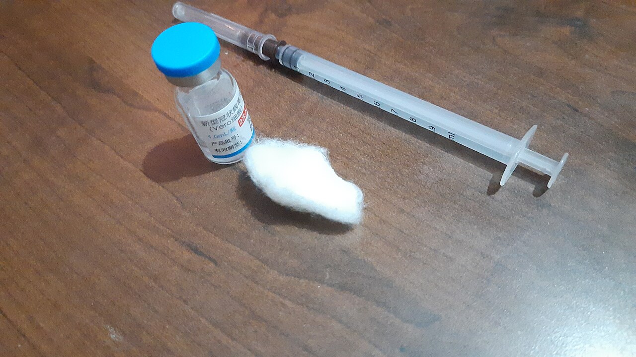 Vero Cell COVID-19 vaccine vial, cotton swab and syringe
